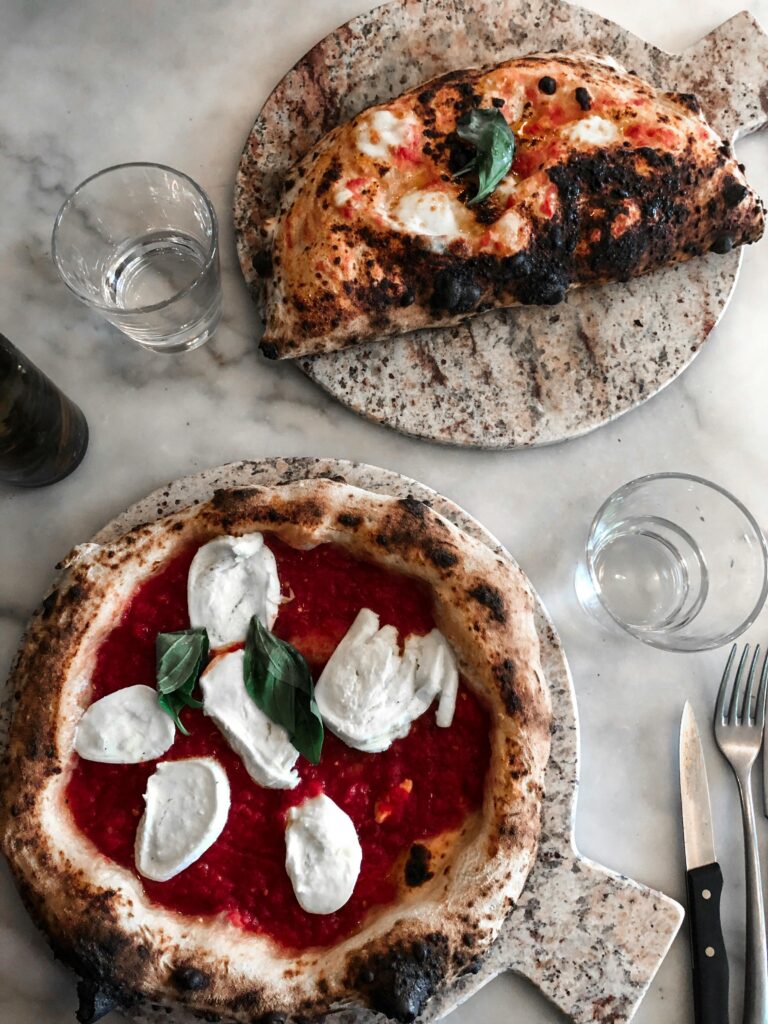 Savoring a traditional neapolitan pizza at a local pizzeria   